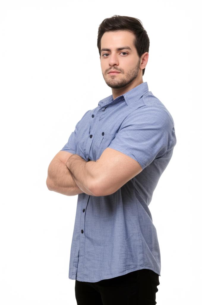 Confident man standing tall with arms crossed, looking strong